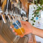 Pouring a glass of draft craft beer from the tap at a brewery Claremont Craft Ales
