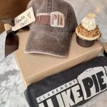 I Like Pie merchandise like hat and t shirt and there is a pie next to it.