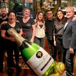 15th anniversary photo of staff and giant balloon at Packing House Wines merchants, bar and restaurant.
